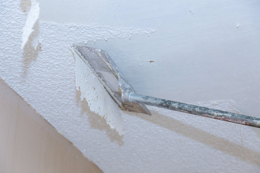removing popcorn ceiling using tool